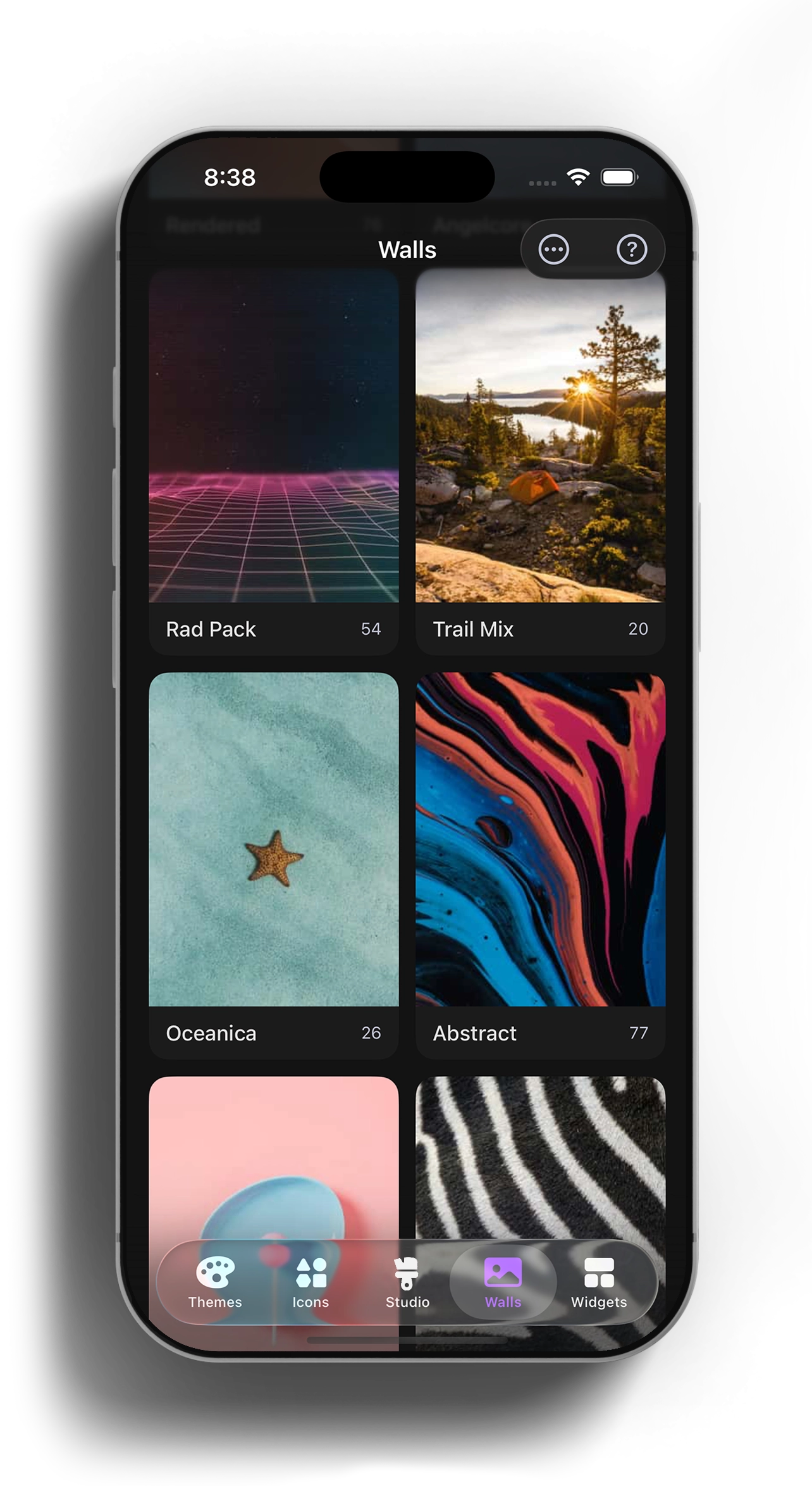 iPhone showing the Walls tab with wallpaper-pack thumbnails